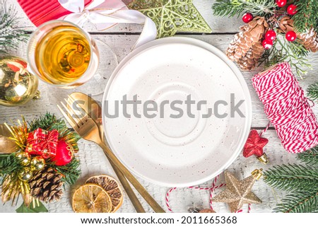  Christmas or New Year table setting. Place setting for Christmas Dinner with Xmas Holiday Decorations