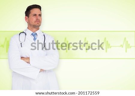 Handsome doctor with arms crossed against medical background with green ecg line
