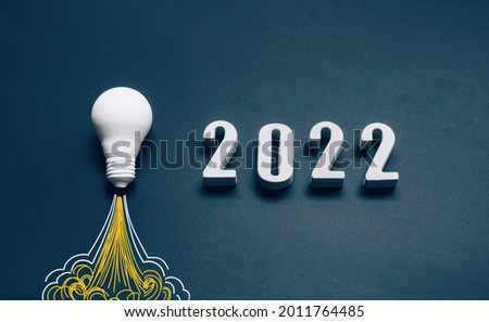 New year 2022 Ideas,inspiration concepts with rocket light bulb and text number background.Business start up or goal to success.creativity of human Royalty-Free Stock Photo #2011764485