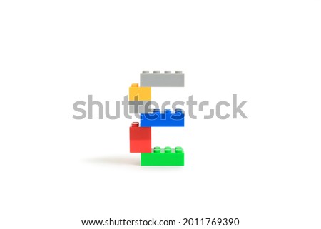 Alphabet letters E from colorful plastic brick block constructor isolated on white background. Image with Clipping path