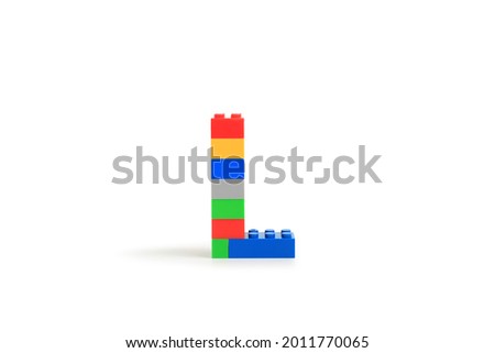 Alphabet letters L from colorful plastic brick block constructor isolated on white background. Image with Clipping path