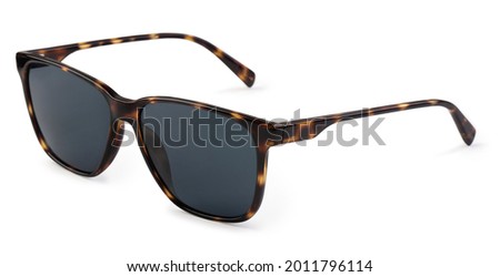 Brown sunglasses in motley frame isolated on white background 