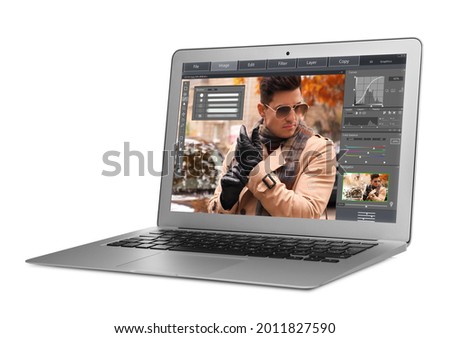 Laptop with photo editor application isolated on white