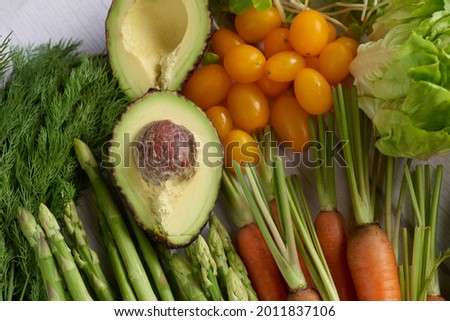 Healthy food background. Food photography different fruits and vegetables on white wooden table background. Copy space. Shopping food in supermarket. studio photo of different fruits and vegetables.