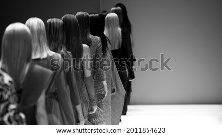 Fashion models at a catwalk during a fashion show or fashion week.