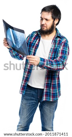 A man holds an x-ray and examines a picture. isolated, white background