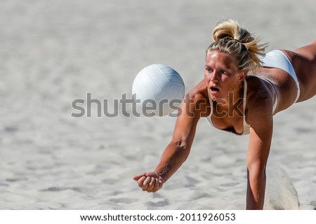 Young girl playing volleyball on the beach. Professional sport concept. Horizontal sport poster, greeting cards, headers, website