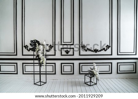 Vintage black and white wall with metal d cor.
