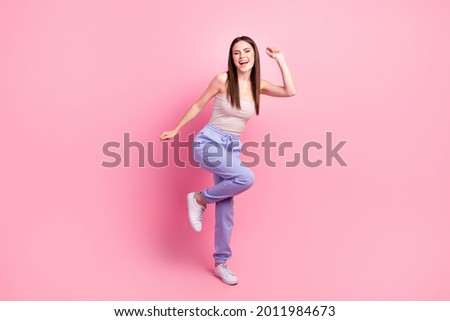 Full body profile side photo of young attractive girl happy positive smile have fun dance isolated over pastel color background