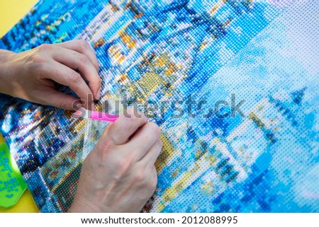 Diamond mosaic painting, Diamond mosaic, fragment of painting close-up, handmade hobby.