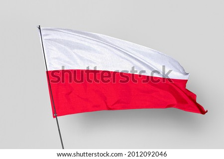 Poland flag isolated on white background. National symbol of Poland. Close up waving flag with clipping path.