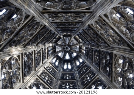 Detail of the top of Dom tower in Cologne. Inside view with sunlight beam. Monochrome picture.