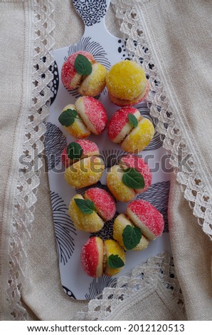 Delicious sweet biscuit pastry the peaches with sugar. Arrangement of peaches shaped homemade cookies.