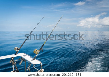 Fishing reels and rods reels .Fishing trolling tuna with speedboat on the pacific ocean.