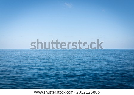 Andaman Sea.Copy space and text Space.Pacific blue sea, Phuket, Thailand.Pattern backgrounds. 
.Calm Sea and Blue Sky Background.Seascape view sky clouds.