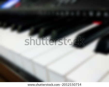 blur image of piano keys