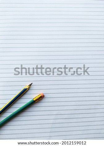 pencil on lined paper background, space for text and drawing