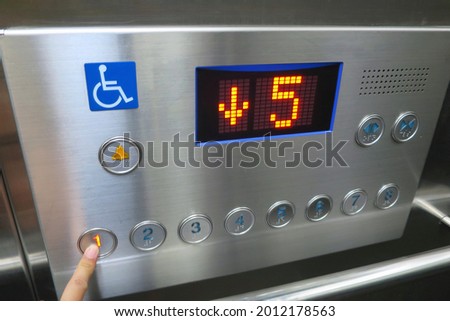 The disabled elevator button with braille code of the elevator. Universal design. Soft focus. Technology, sign and symbol concept.