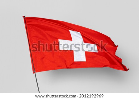 Switzerland flag isolated on white background. National symbol of Switzerland. Close up waving flag with clipping path.