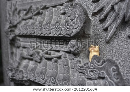 Abstract: Owl statue outing - fine temple's stone carving 
