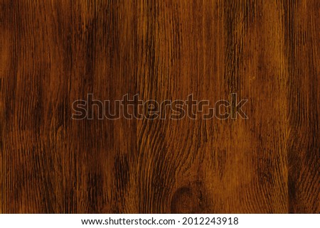 Dark background brown texture lacquered wood. Empty flat surface. Natural pattern on the board. Backdrop for an ad