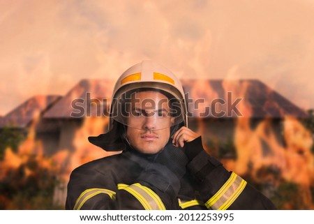 Rescuer wearing uniform and helmet. Professional firefighter