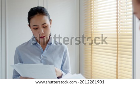 Young female leader, asia people lady or mba student standing look in front of mirror fear tired pep talk for sale pitch hold paper document script public speak skill for job career lost self improve. Royalty-Free Stock Photo #2012281901