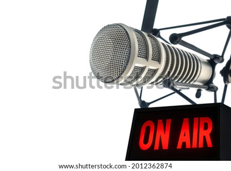 Professional microphone in radio station studio and on air sign Royalty-Free Stock Photo #2012362874