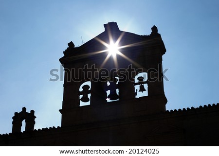 Ray of lights cross belfry. Old monastery in Salamanca city, Spain