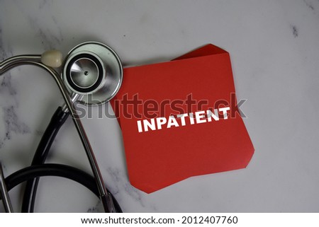 Inpatient write on sticky notes isolated on Wooden Table.