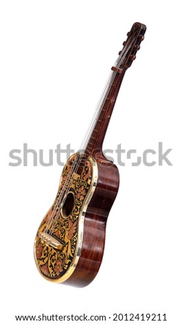Souvenir guitar with golden ornamented isolated on a white background