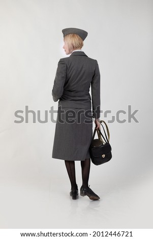 Woman actor reenactor in the historical uniform of the army during World War II Royalty-Free Stock Photo #2012446721