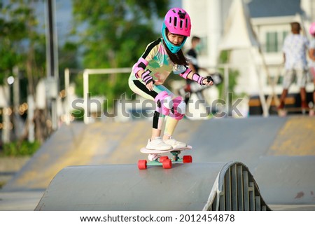 asian girl riding sufe skate or skateboarding on the ram 