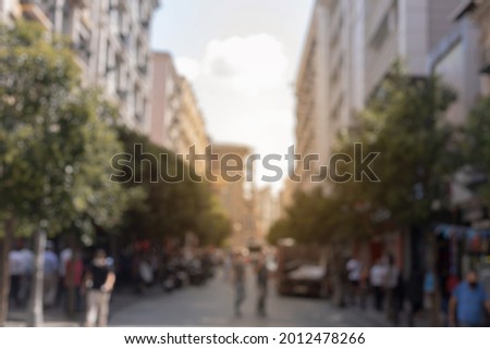 Blur texture background for design. Out of focus views of the streets of an eastern city on a sunny summer day