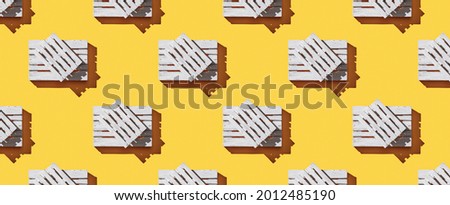 Pattern wooden pallets on yellow pastel background