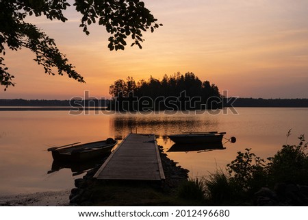 Scenic lake view at dawn in Sweden.