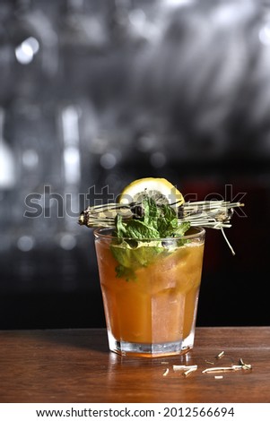 exotic and alcoholic drink with fruits on black background.