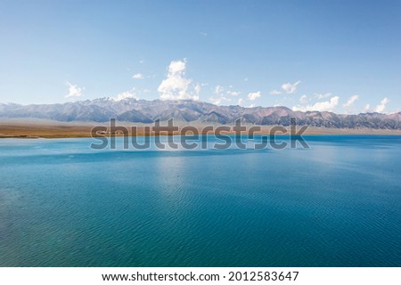 Lake and grassland with a sunny day. Shot in Sayram Lake, Xinjiang, China.