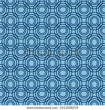 Seamless geometric pattern of circles on a blue background. Simple pattern. Clothing fabric print. Seamless trellis background