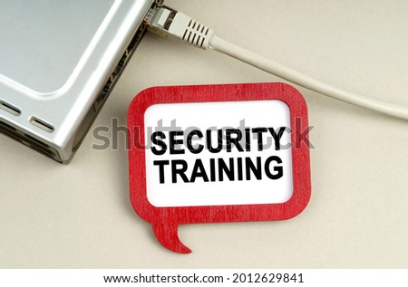 Internet and security concept. There is a router connected to the network on the table, next to a sign that says - Security Training