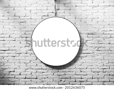 Mockup round lightbox. White blank circle space frame on white brick wall background.