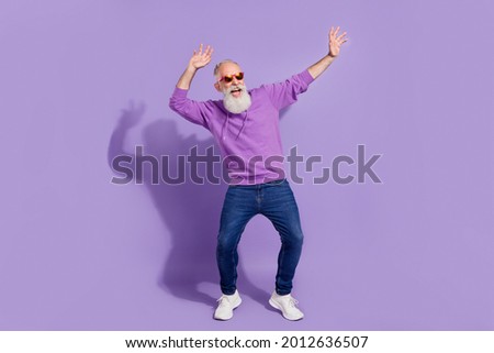 Full length body size view of attractive cheerful carefree grey-haired man dancing fooling isolated over purple violet color background