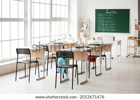 Empty school classroom prepared for exam Royalty-Free Stock Photo #2012671676