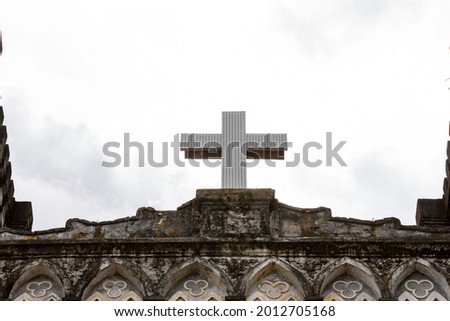 Catholic Cross On The Top Of Mang Lang Church Of Phu Yen Province, Vietnam. Mang Lang Church Is One Of The Oldest Churches In Vietnam Imbued With An Architectural Style Of The 19th Century