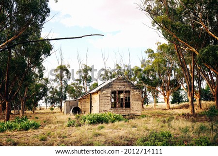 Historic rundown school, dilapidated old building in rural Central Victoria, Australia. Abandoned building in Mologa. Australian bush land.  Royalty-Free Stock Photo #2012714111