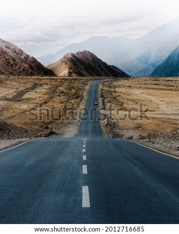 Endless straight road in ladakh, India  Royalty-Free Stock Photo #2012716685