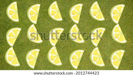 Composition of rows of lemon slices on green background. summer, fruit and colour concept digitally generated image.