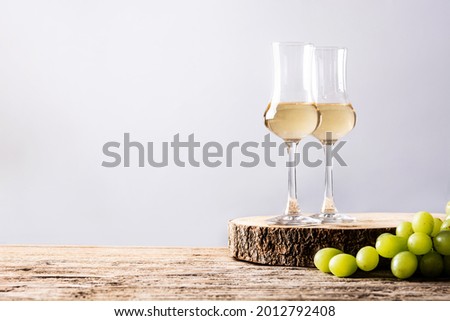 Italian golden grappa drink on wooden table. Copy space Royalty-Free Stock Photo #2012792408