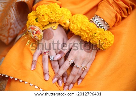 Pakistani indian bride and groom hand Pictures and showing wedding rings and Wrest Watch,