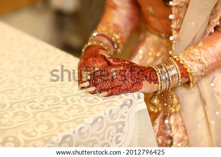 Pakistani indian bride and groom hand Pictures and showing wedding rings and Wrest Watch,